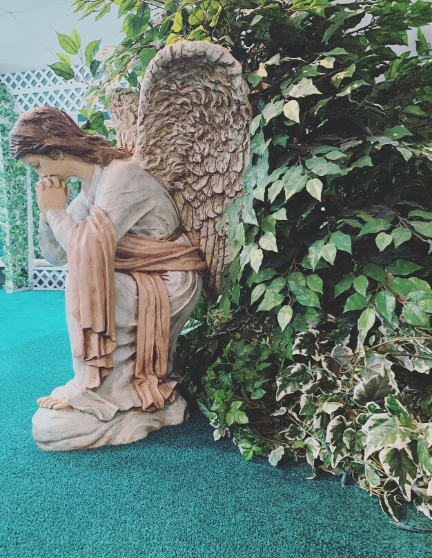 A statue of an angel-like creature